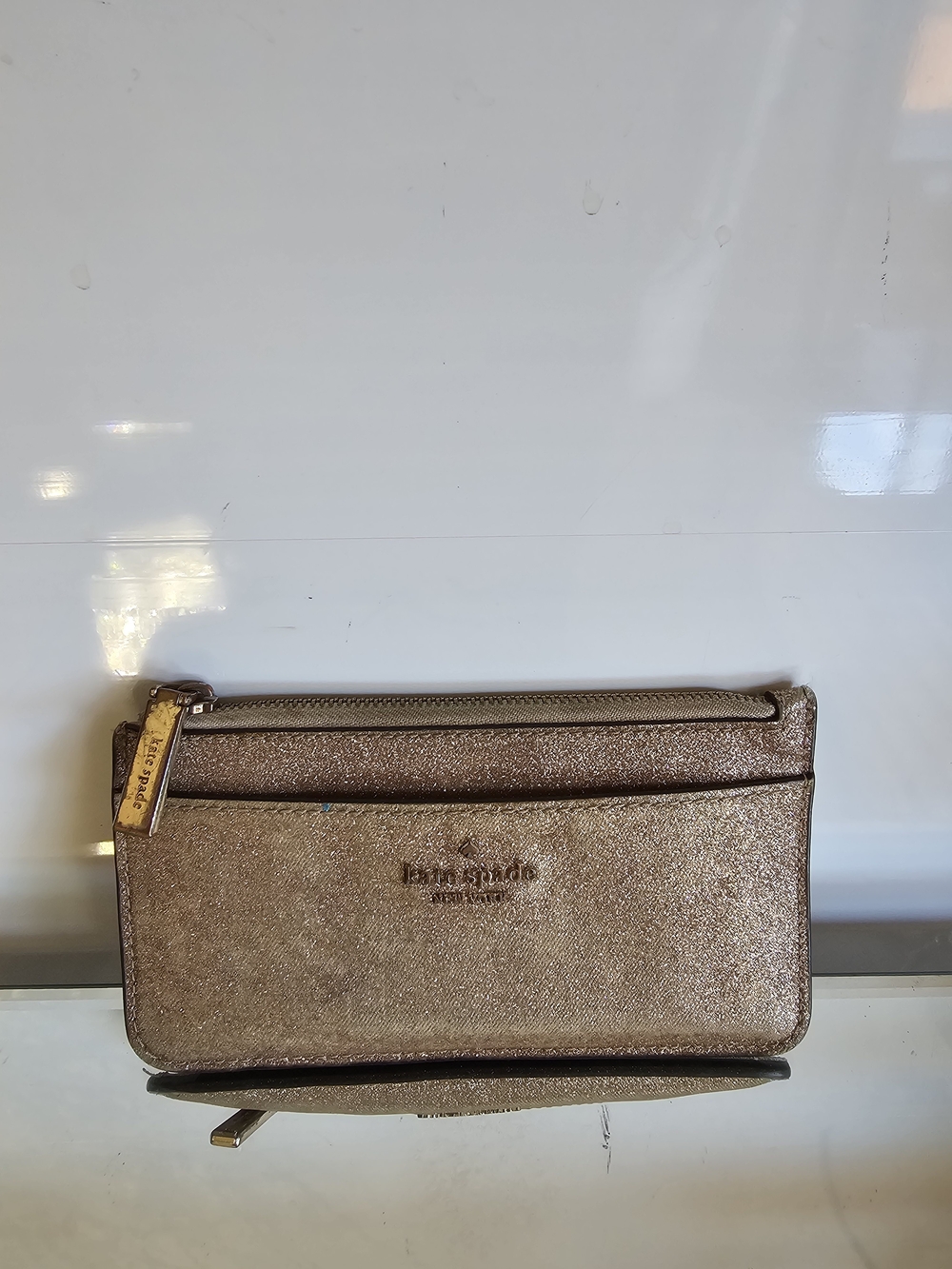 kate spade metallic rose gold wristlet wallet with zip pocket